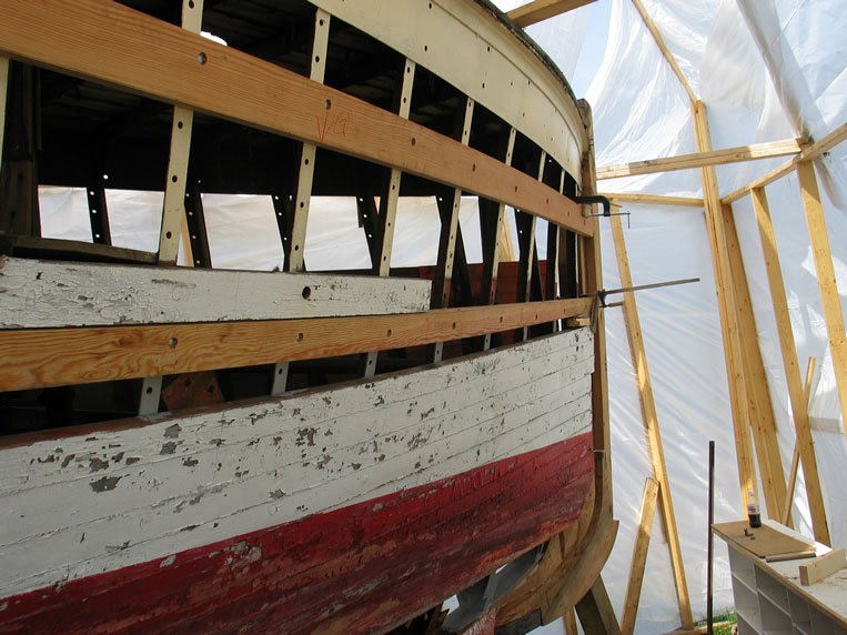 The hull before restoration — decades of submersion and weathering